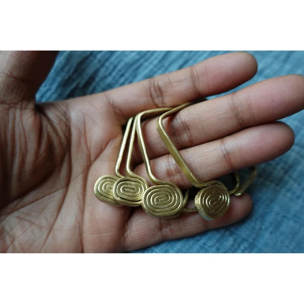 set of 4 Vintage napkin rings metal brass with swirl rectangular design